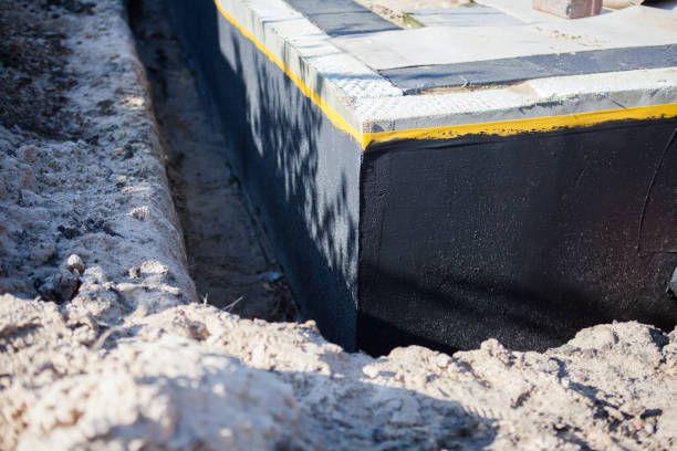 Professional Waterproofing technician working in Weaver, AL
